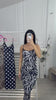 Zebra print: Crno-bela midi haljina od likre sa zebra dezenom, uskog kroja.
