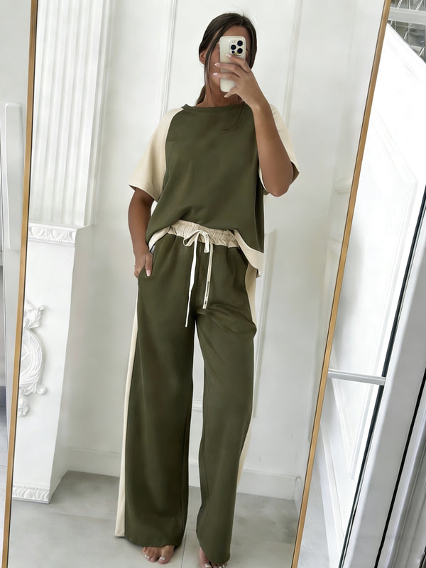 Ovaj elegantni zeleni ženski set donosi savršen spoj udobnosti i modernog stila. Komplet se sastoji od lagane majice i širokih pantalona sa elastičnim pojasom, pružajući maksimalnu slobodu pokreta i celodnevni komfor. Prirodna zelena nijansa prati aktuelne trendove (earth tones) i lako se uklapa u svakodnevne outfite – od opuštenih šetnji do urbanih kombinacija.
