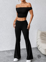 Crni ženski komplet elegantnog kroja sa off shoulder majicom i pantalonama